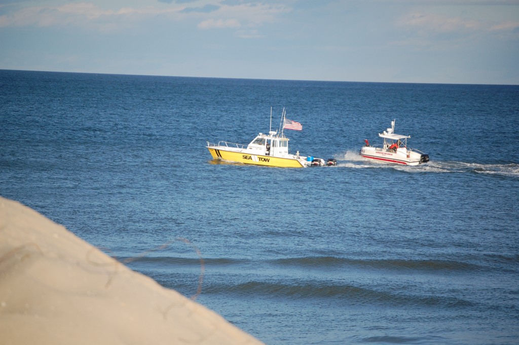 The Laurelton Fire Company boat, as well as a Sea Tow boat, in the ocean off Brick Beach 1 following a rescue Sunday. (Photo: Daniel Nee)