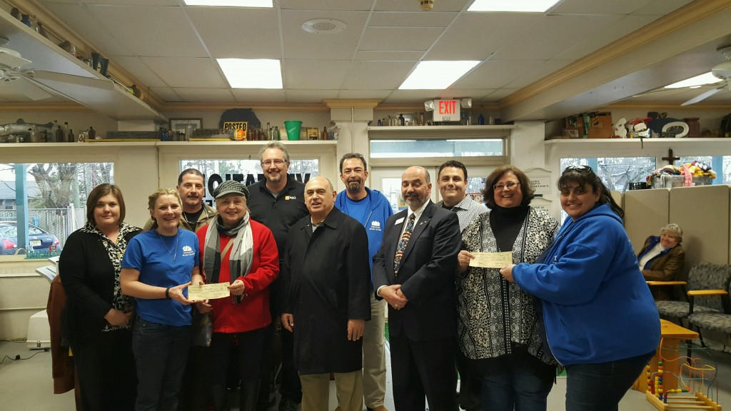 Members of the Brick Township Rotary Club present members of the Visitation Relief Center with a donation. (Photo: Brick Rotary)