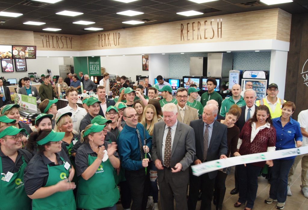 Township officials and store employees at QuickChek cut the ribbon at the new Brick location.