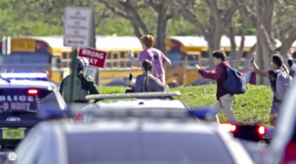 Students and law enforcement outside Marjory Stoneman Douglas High School in Parkland, Fla. (Credit: NBC News)