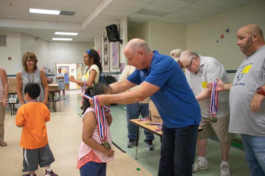 Brick Township council member Paul Mummolo helps award medals after the Knights of Columbus Field Day event, July 2018. (Photo: Chris Chase/Brick Twp.)