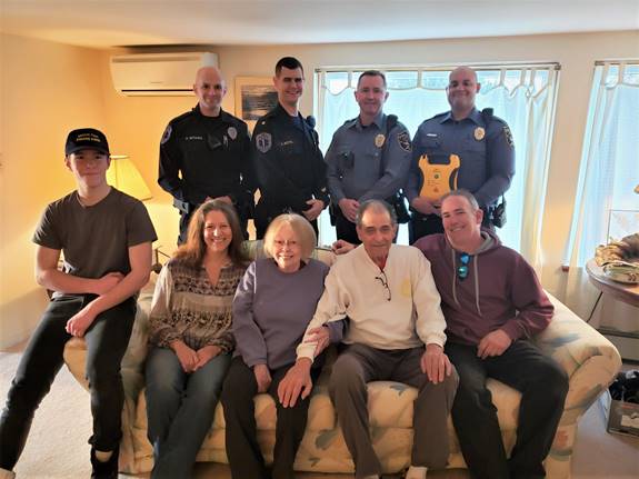 EMT Paul Witham, EMT Supervisor Anthony Botts, Ptl. Mark Storch, and Ptl. Anthony Chadwick (holding an AED). Front row, left to right: Shane Cartwright, Roberta Cartwright, Susan Schwab, Carl Schwab, and Peter Cartwright. Not pictured, EMT Kyle Matthews.