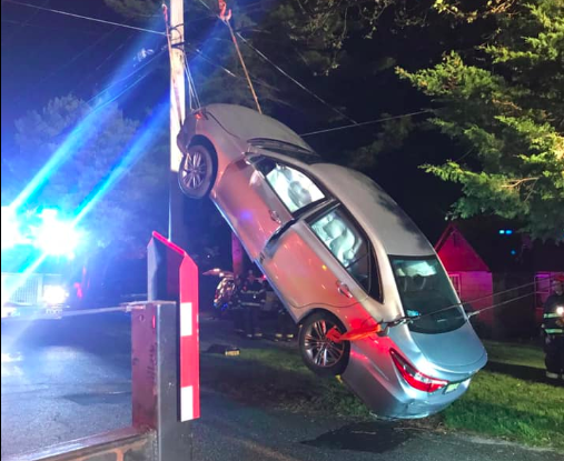 A vehicle propped vertically against a pole, May 12, 2019. (Photo: Laurelton Fire Company)