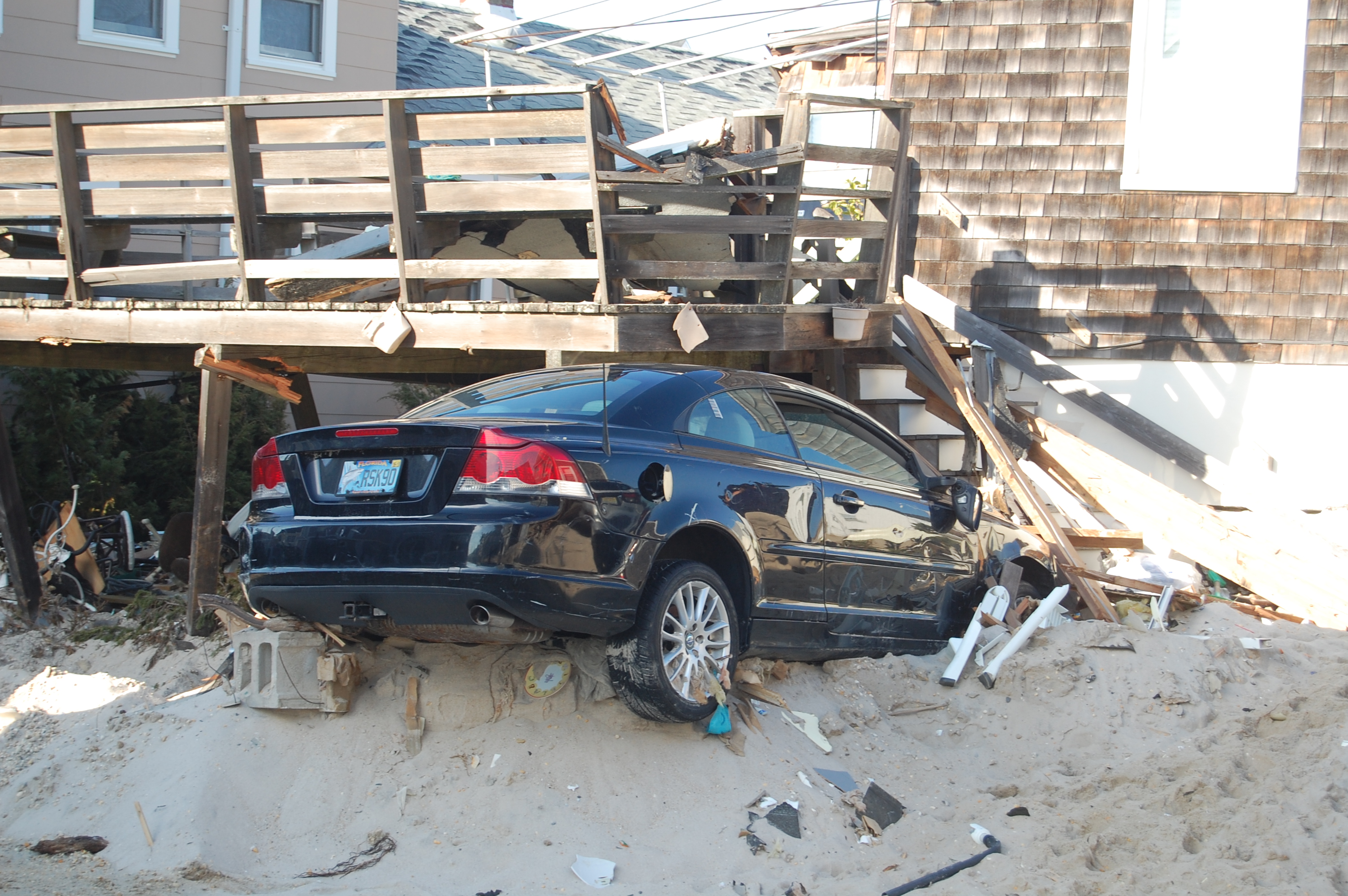 A car that stuck inside a house in Brick's Normandy Beach section, Nov. 2012. (Photo: Daniel Nee)