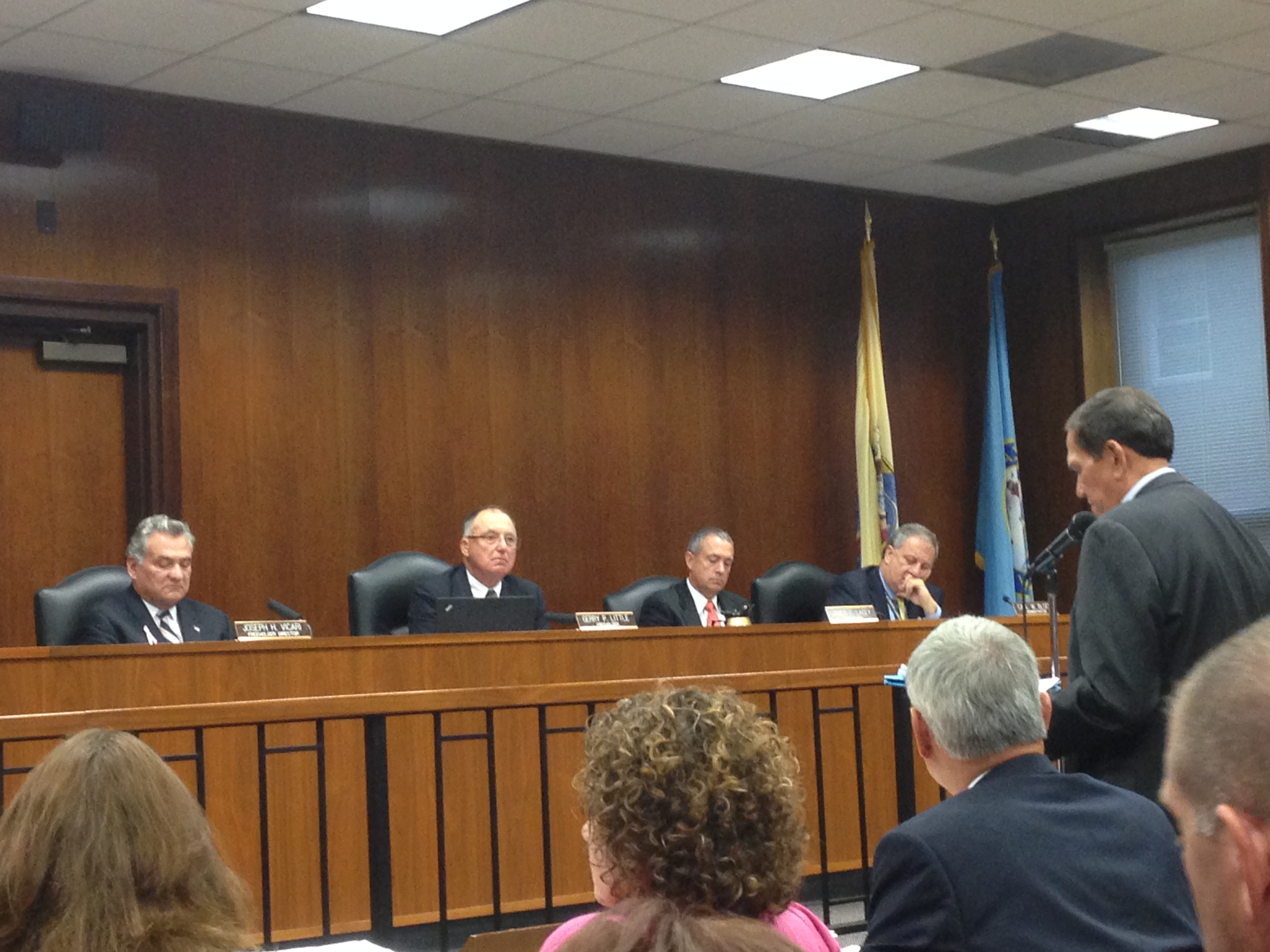 William Santos (right, at microphone) addresses the Ocean County freeholders on Oct. 15, 2014. (Photo: Daniel Nee)