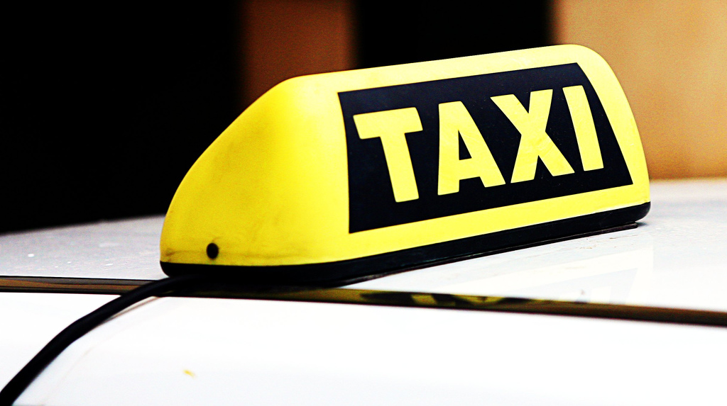 A taxicab sign. (Photo: Leonid Mamchenkov/Flickr)