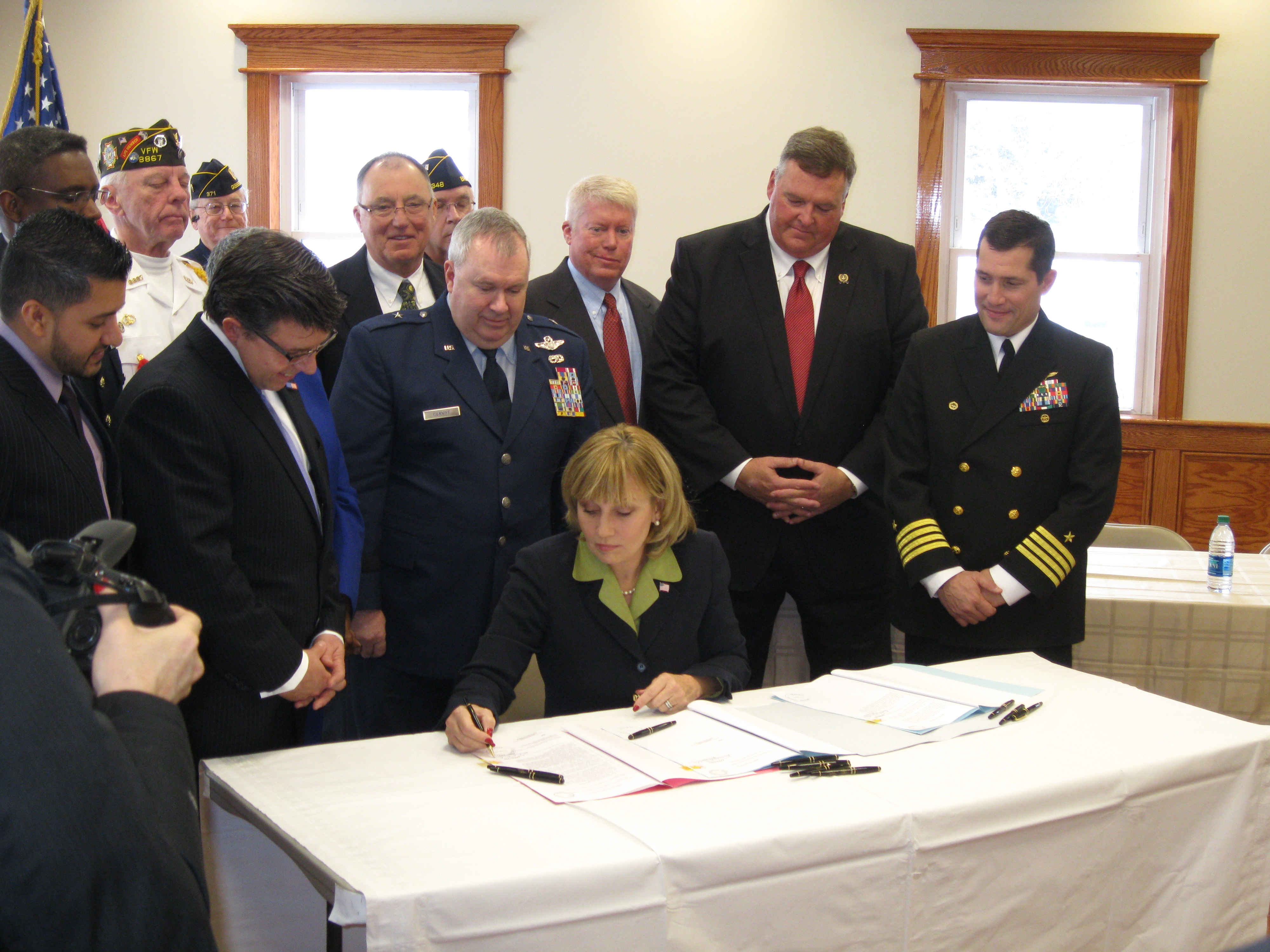 Lt. Gov. Kim Guadagno signs a bill into law in Brick, N.J. renaming the Route 35 bridge over the Manasquan River for veterans. (File Photo)