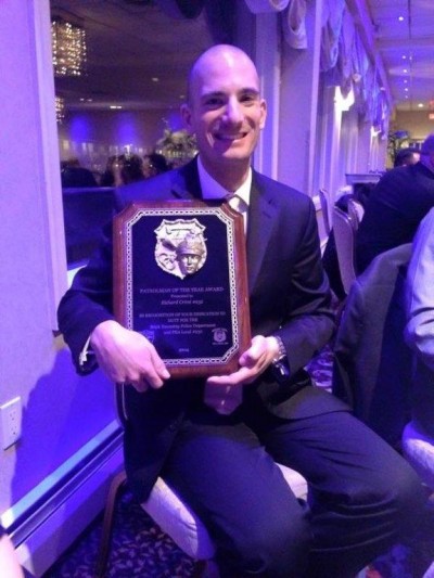 Ptl. Richard Crimi with his Police Officer of the Year Award.