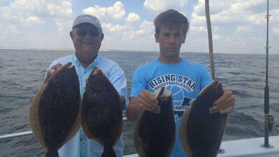 Grandpa Denny and Grandson Ryan on board the Cock Robin party boat out of Point Pleasant Beach this week. The pair nabbed four keeper fluke! (Photo: Cock Robin Crew)
