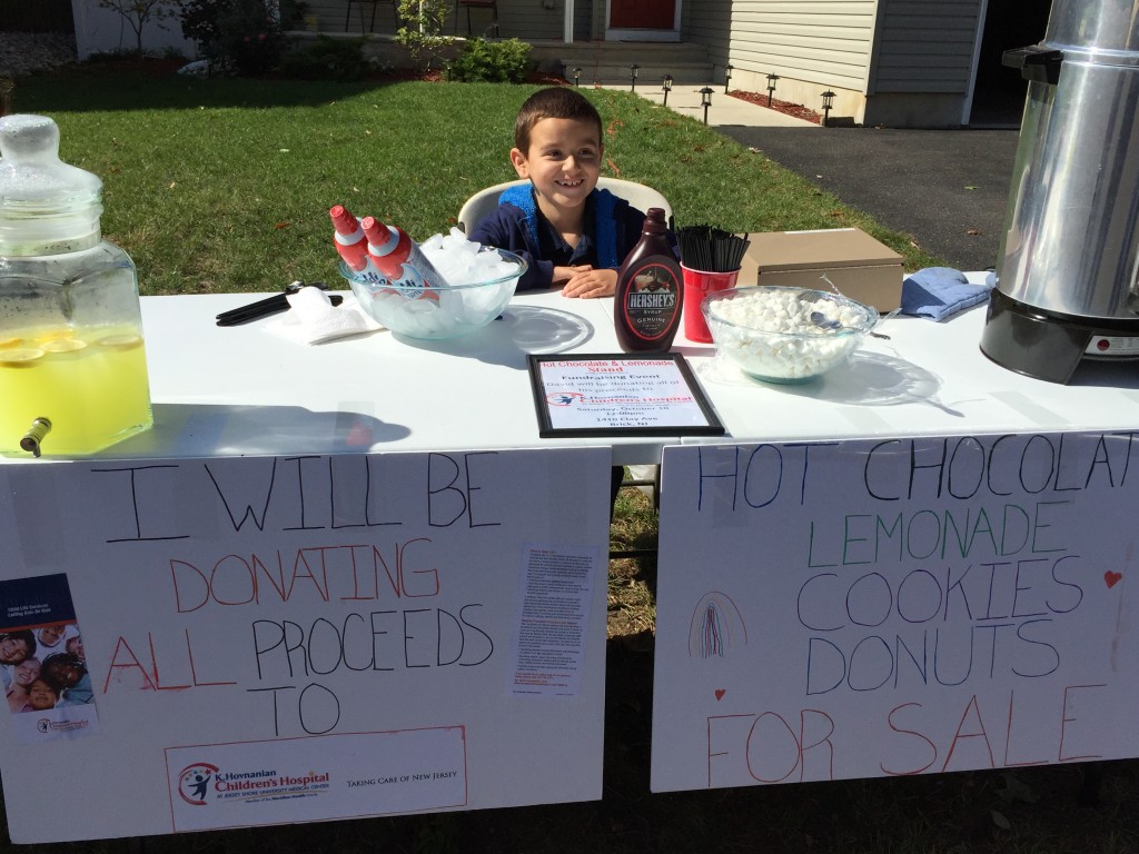 David Torres, 7, runs a charity lemonade stand in front of his house. (Photo: Kristina Torres)