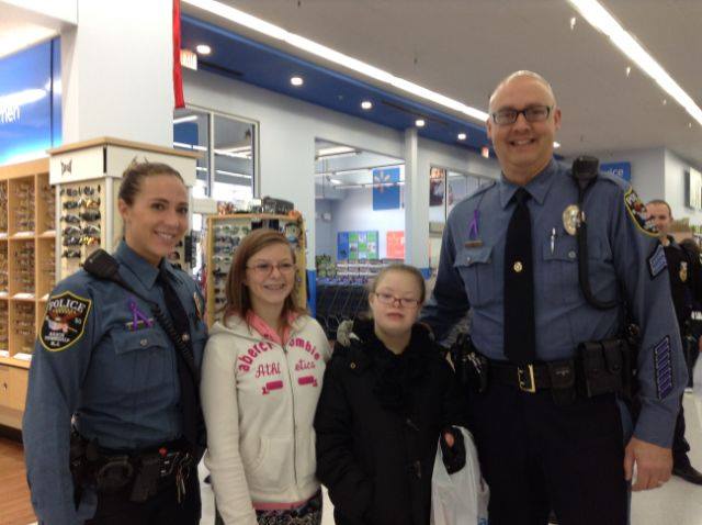 Brick police officers help kids pick out toys at the local Walmart store. (Photo: Brick Twp. Police)