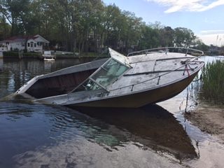 A boat set adrift in the Metedeconk River. (Photo: Brick Twp. Police)
