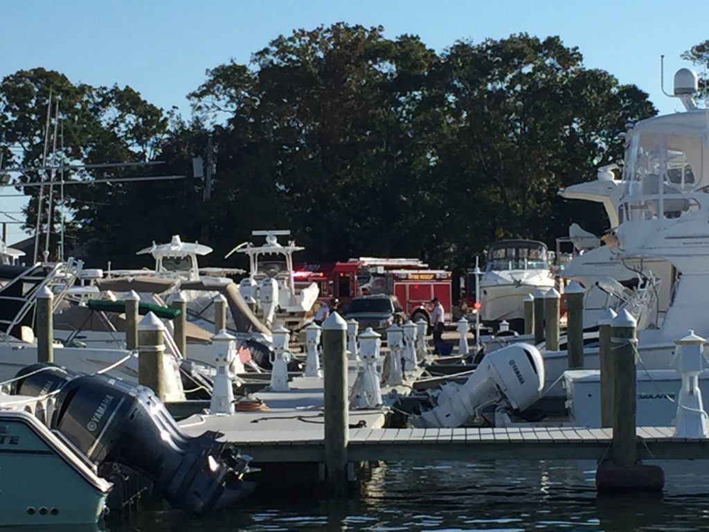 Firefighters remain on the scene of a boat fire at Comstock Marina in Brick. (Photo: Daniel Nee)