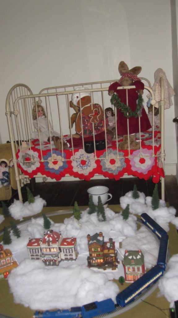 An iron crib decorated for Christmas at the Havens Homestead museum. (Photo: Brick Historical Society)