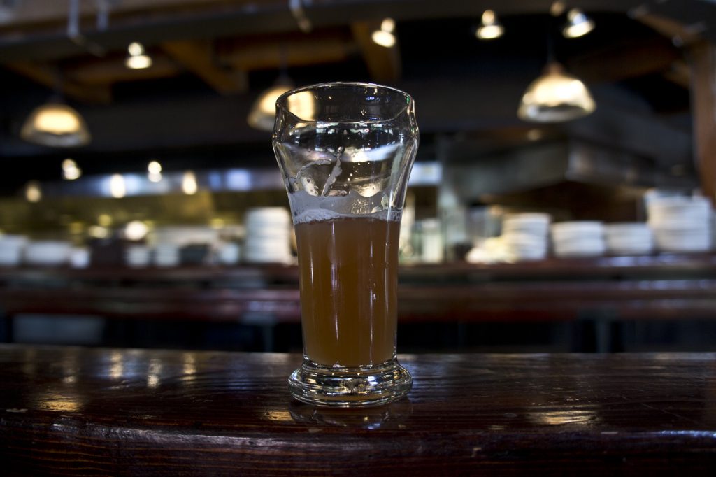 A beer glass on top of a bar. (Photo: Ruocaled/Flickr)