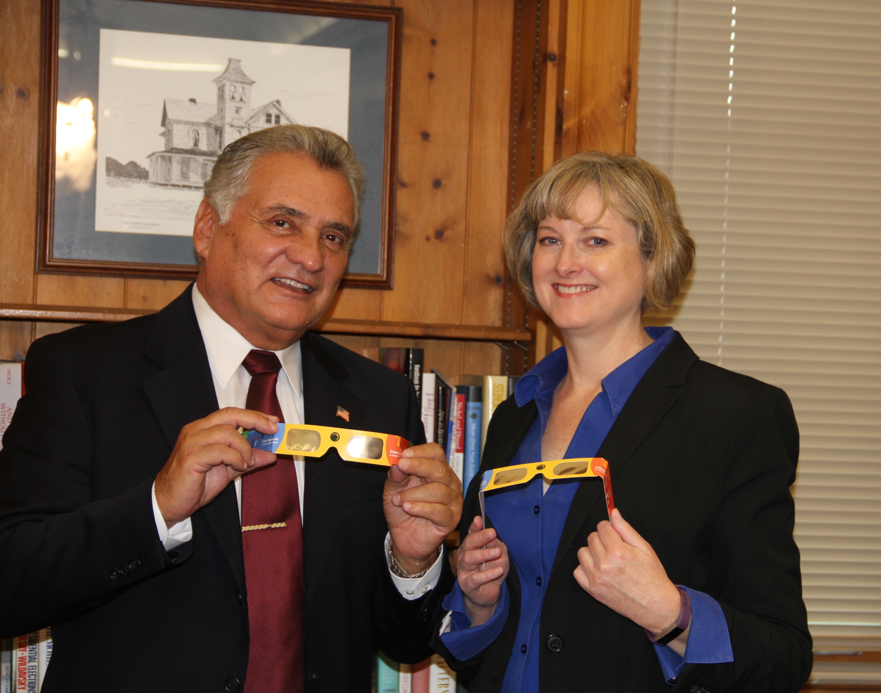 Ocean County Freeholder Director Joseph H. Vicari and Ocean County Library Director Susan Quinn check out the “Eclipse Shades” that were distributed by the Ocean County Library. (Photo: Ocean County)