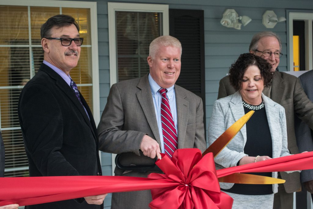 Mayor John Ducey (center) and Councilman Jim Fozman help cut to ribbon at a new group home on Drum Point Road. (Photo: Daniel Nee)