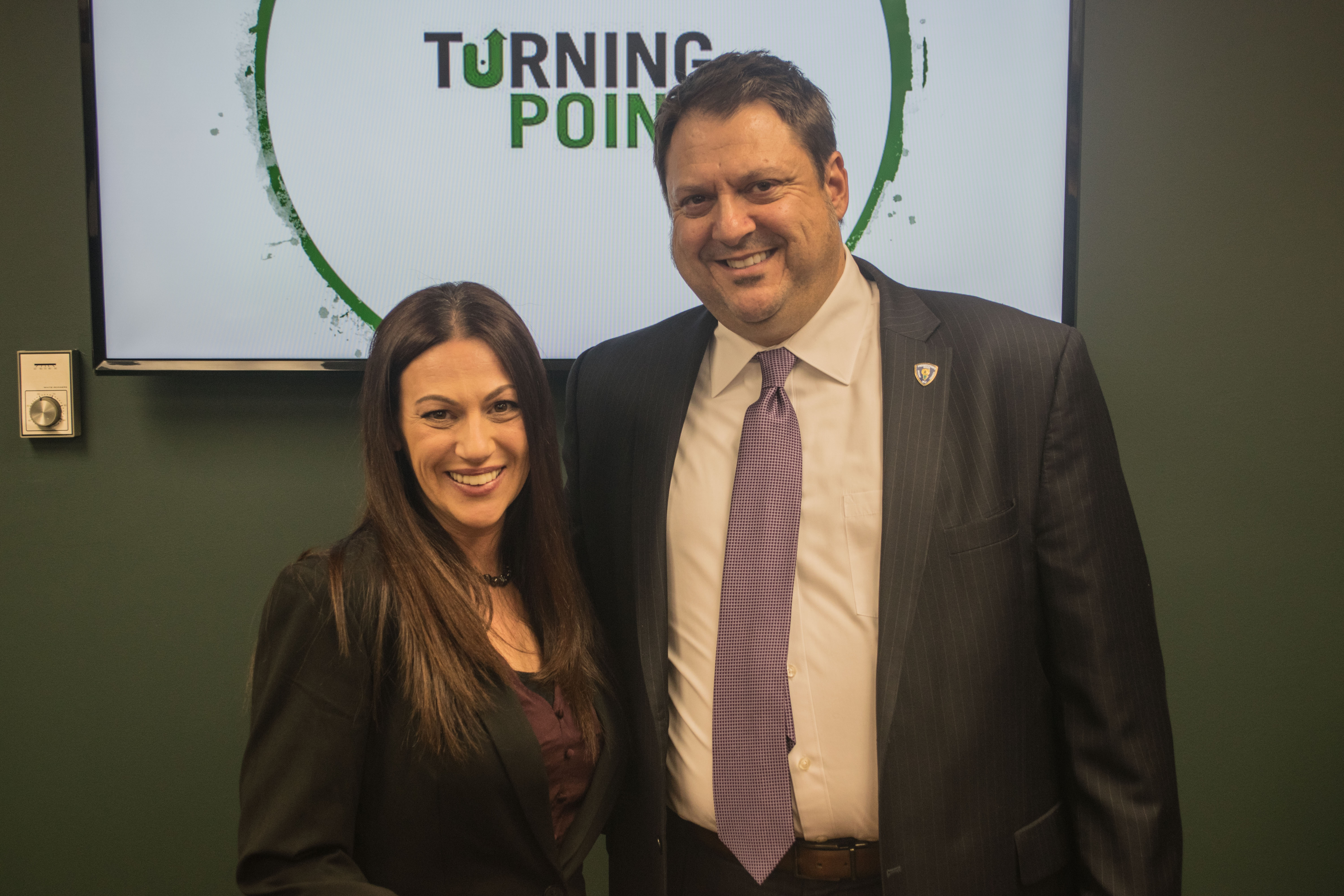 Ocean County Prosecutor Bradley Billhimer and Holly, who successfully completed Turning Point's program. (Photo: Daniel Nee)