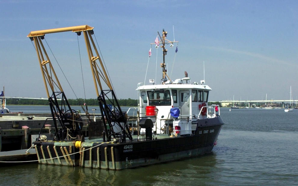 A 49-foot stern-loading buoy tender, better known as a BUSL, sits moored at a Coast Guard station. (Coast Guard Photo: Telfair H. Brown, Sr.)