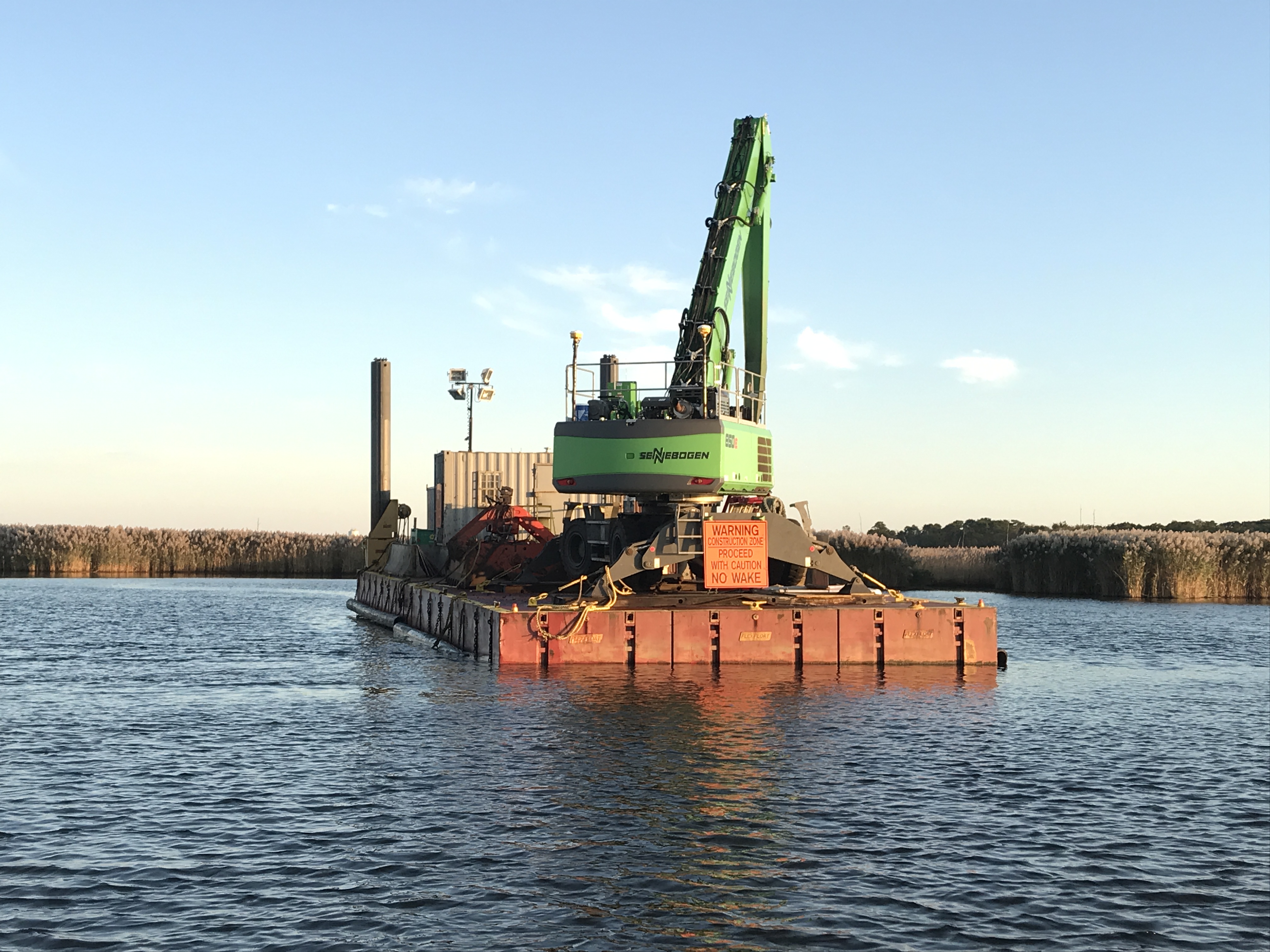 A dredge barge rests in the narrows of the Metedeconk River on Oct. 16, 2019. (Photo: Daniel Nee)