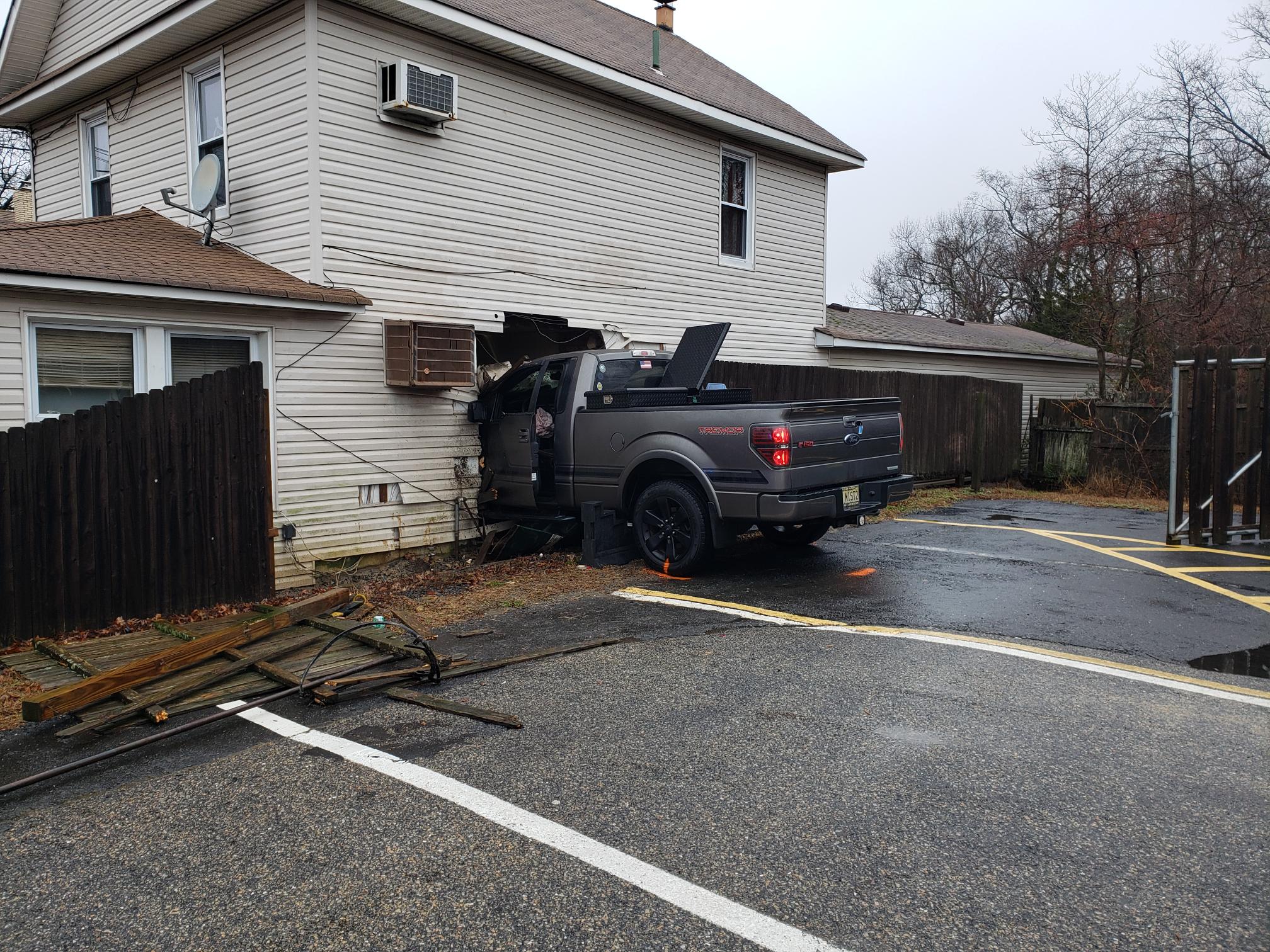 A truck crashes into a home at 372 Drum Point Road. (Photo: Brick Twp. Police)