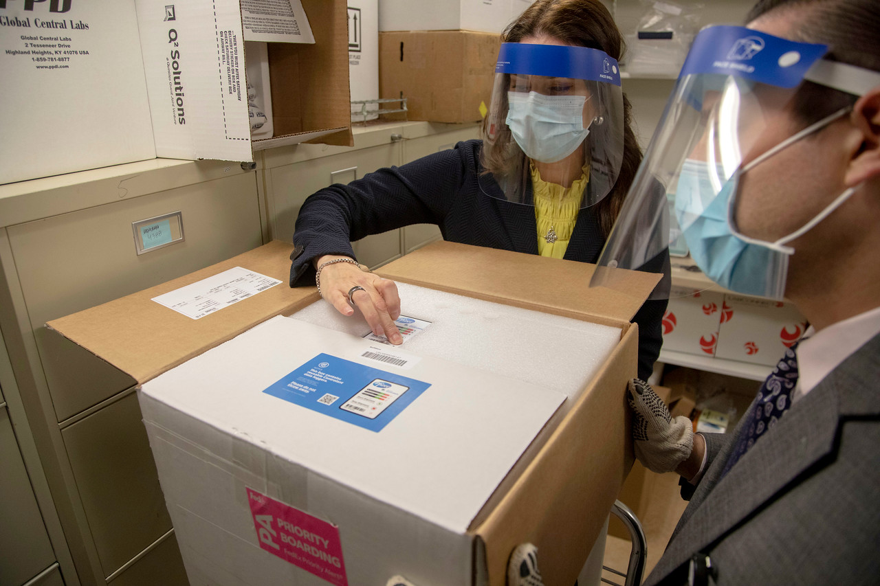 FedEx delivered the first tray of the Pfizer COVID-19 vaccine to Holy Name Medical Center in Teaneck, NJ. Nancy Palamara and Joseph Cruz accepted the vaccine and stored it in the 80 degree below zero freezer. (Credit: Jeff Rhode/Holy Name Medical Center)