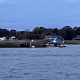 NJ State Police and U.S. Coast Guard vessels push and 'island' through the Metedeconk River in Brick, N.J., Nov. 11, 2021. (Photo: Daniel Nee)
