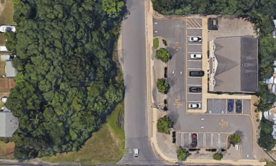 The property at 341 Drum Point Road, Brick, N.J. (wooded lot) where three homes are proposed. (Credit: Google Maps)