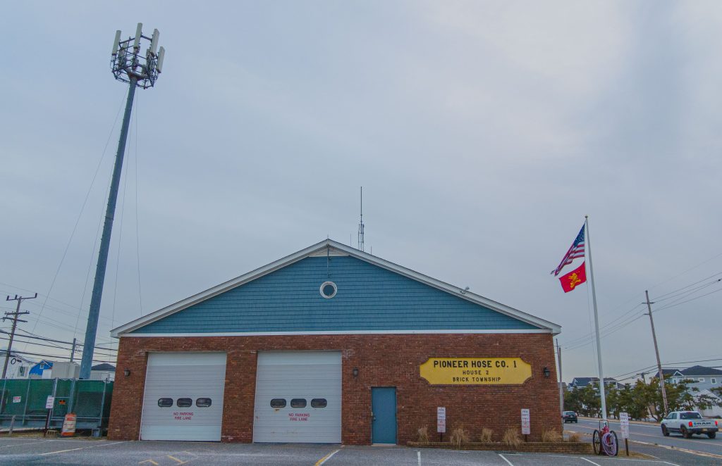 The Pioneer Hose fire company's station on Route 35 in Brick, flanked by a communications tower. (Photo: Daniel Nee)
