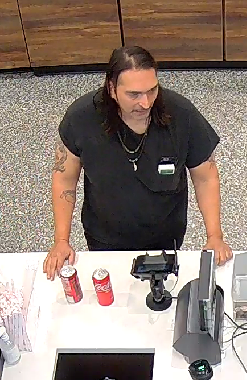 A surveillance photo of a man suspected of using a stolen credit card at a local store. (Photo: Brick Twp. Police)