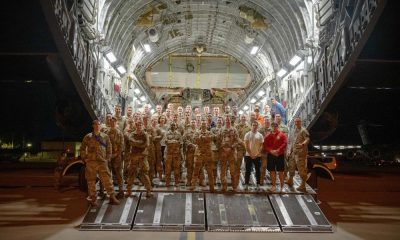U.S. Air Force Airmen from Pope Army Airfield, North Carolina, Joint Base Charleston, South Carolina, and Joint Base McGuire-Dix-Lakehurst, New Jersey, take a moment to pose on a C-17 at Pope AAF Feb. 16, 2022. The team, Task Force Gryphon, operated a 24-hour schedule to coordinate the transportation and delivery of personnel and cargo to Poland and Germany in the United States steadfast commitment to Ukraine’s sovereignty and territorial integrity in support of a secure and prosperous Ukraine. (U.S. Air Force photo/Staff Sgt. Katelynn Thomas)