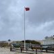 A red flag flies over cloudy skies at Brick Beach III, May 6, 2022. (Photo: Daniel Nee)
