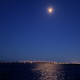 The moon rises over the Mantoloking Bridge, Brick Township, N.J., Aug. 2022. (Photo: Daniel Nee)