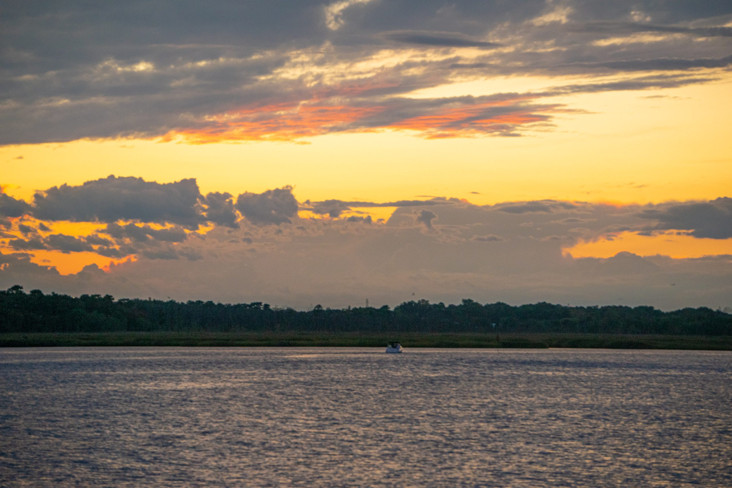 Sunset over the Metedeconk River, from Windward Beach, Brick, N.J., Sept. 26, 2022. (Photo: Daniel Nee)