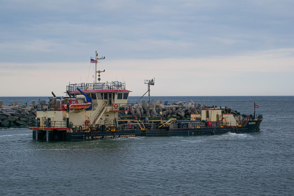 The USACE dredge boat Murden clears a channel through Manasquan Inlet, Feb. 6, 2023. (Photo: Daniel Nee)