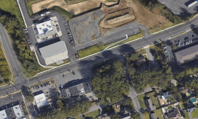 The wooded area (bottom, center) is the proposed site of a car was, opposite an existing Wawa store. (Credit: Google Maps)