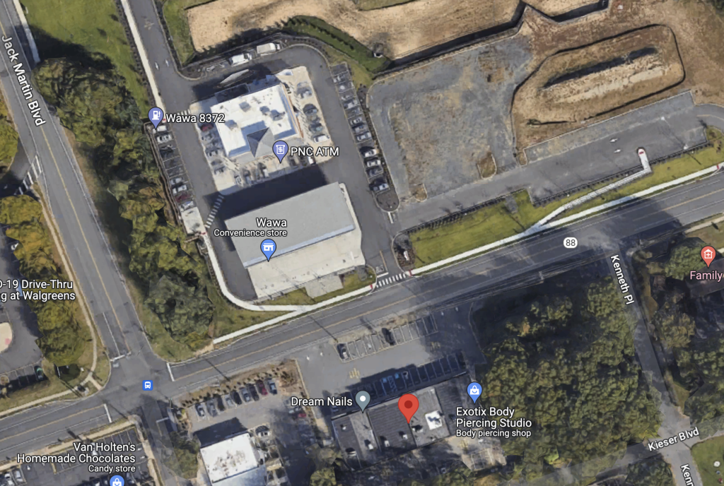 The wooded area (bottom, right) is the proposed site of a car was, opposite an existing Wawa store. (Credit: Google Maps)
