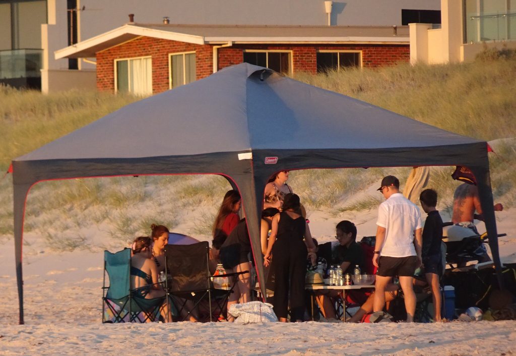 A tent/canopy set up on the beach. (Credit: Michael Coghlan/ Creative Commons)