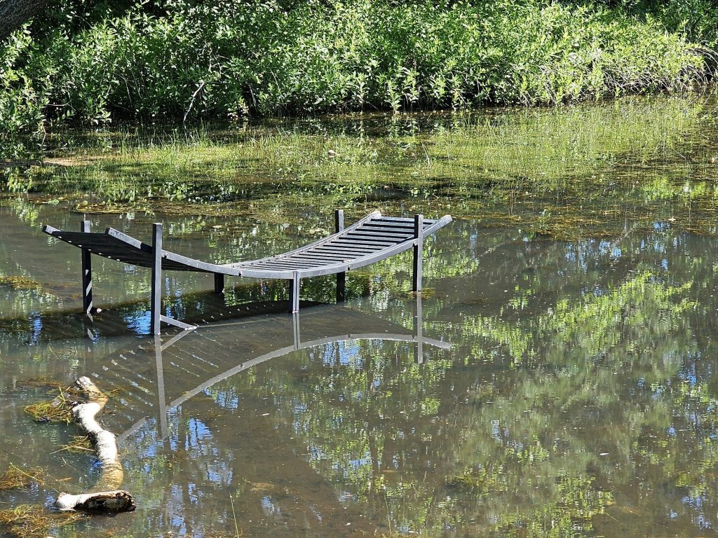 A makeshift bridge to help pedestrians navigate the walking path at Godfrey Lake, Brick, N.J. (Credit: Kevin Boggio/ Facebook)