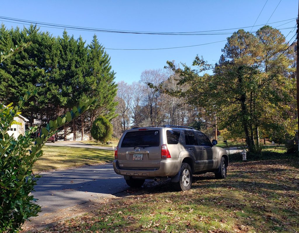 A car parked on a front lawn. (Source: Reddit/Submitted File)