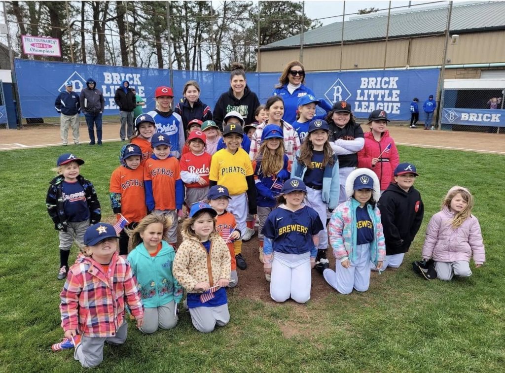 Mayor Lisa Crate joins girls from the Brick Little League program as they begin their season in 2024. (Photo: Brick Little League)